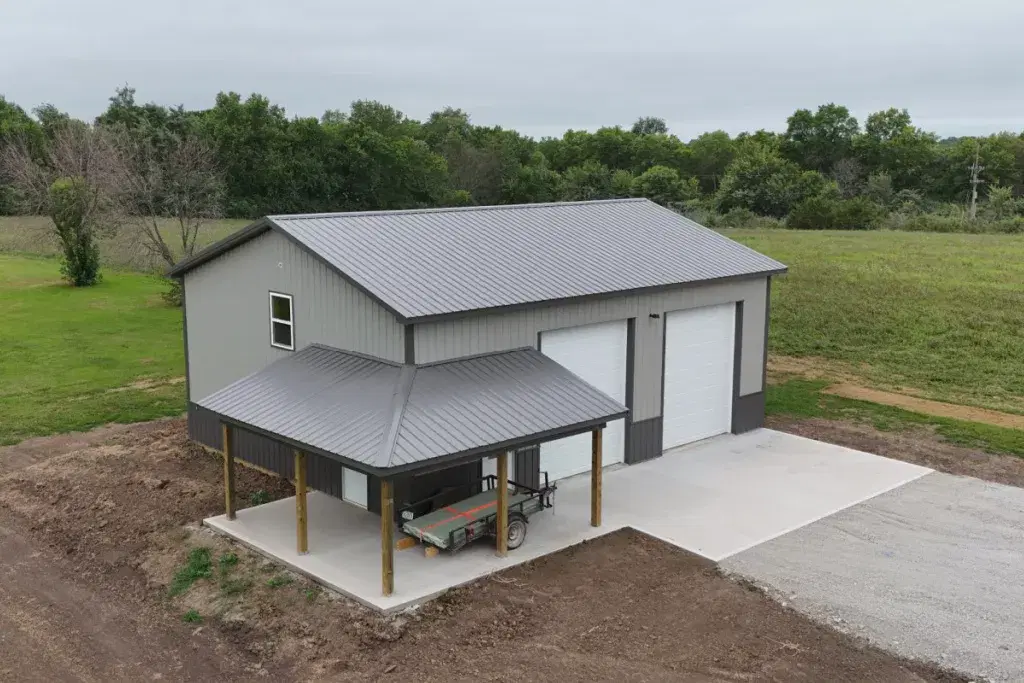 Durable commercial pole barn workshop with multiple bay doors.